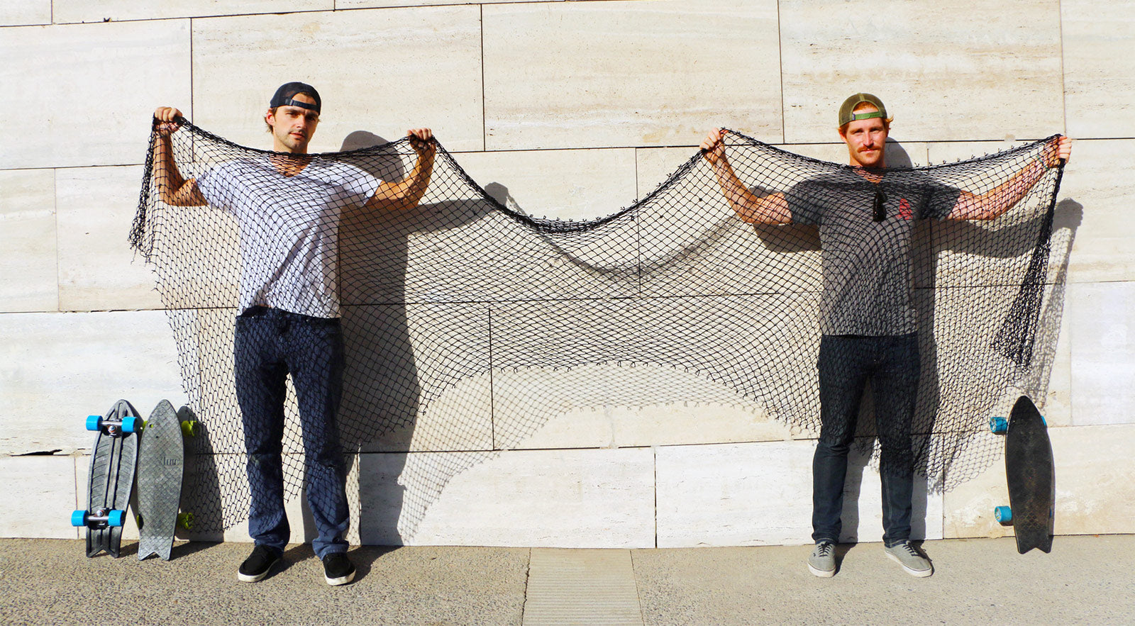 Bureo co-founders Ben Kneppers (left) and Kevin Ahearn (right) display the amount of fishing net that’s recycled into each Bureo skateboard through Net Positiva, Bureo’s fishing net collection and recycling program. Santiago, Chile. Photo: Kevin Ahearn