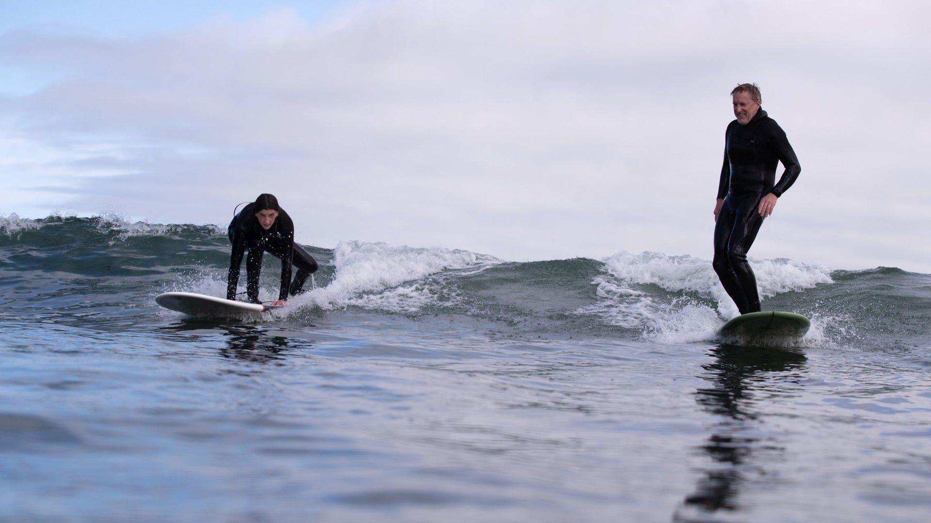 One of the many secrets to enjoying yourself in sloppy surf is finding out whether the waves have room for two. Pacifica, California.