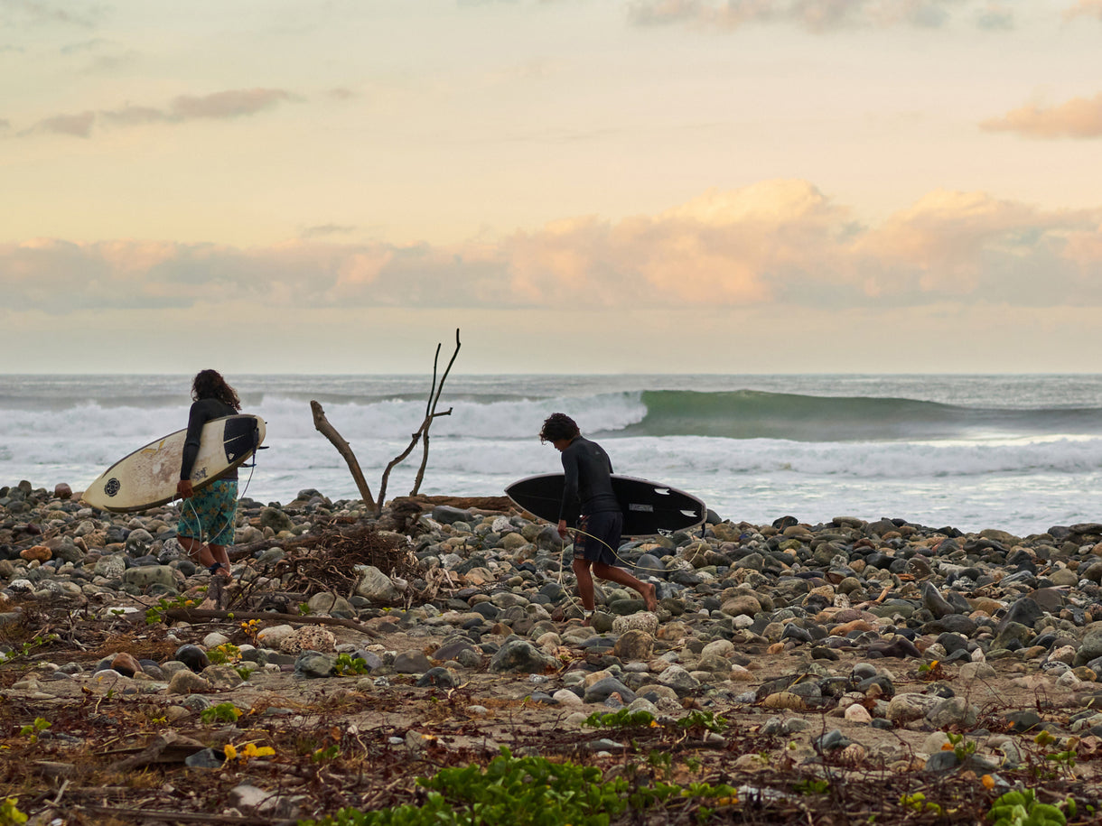 Marc Chavez, left, and Reg Macarro, right, about to paddle out at a reeling left pointbreak somewhere in Michoacán, Mexico.