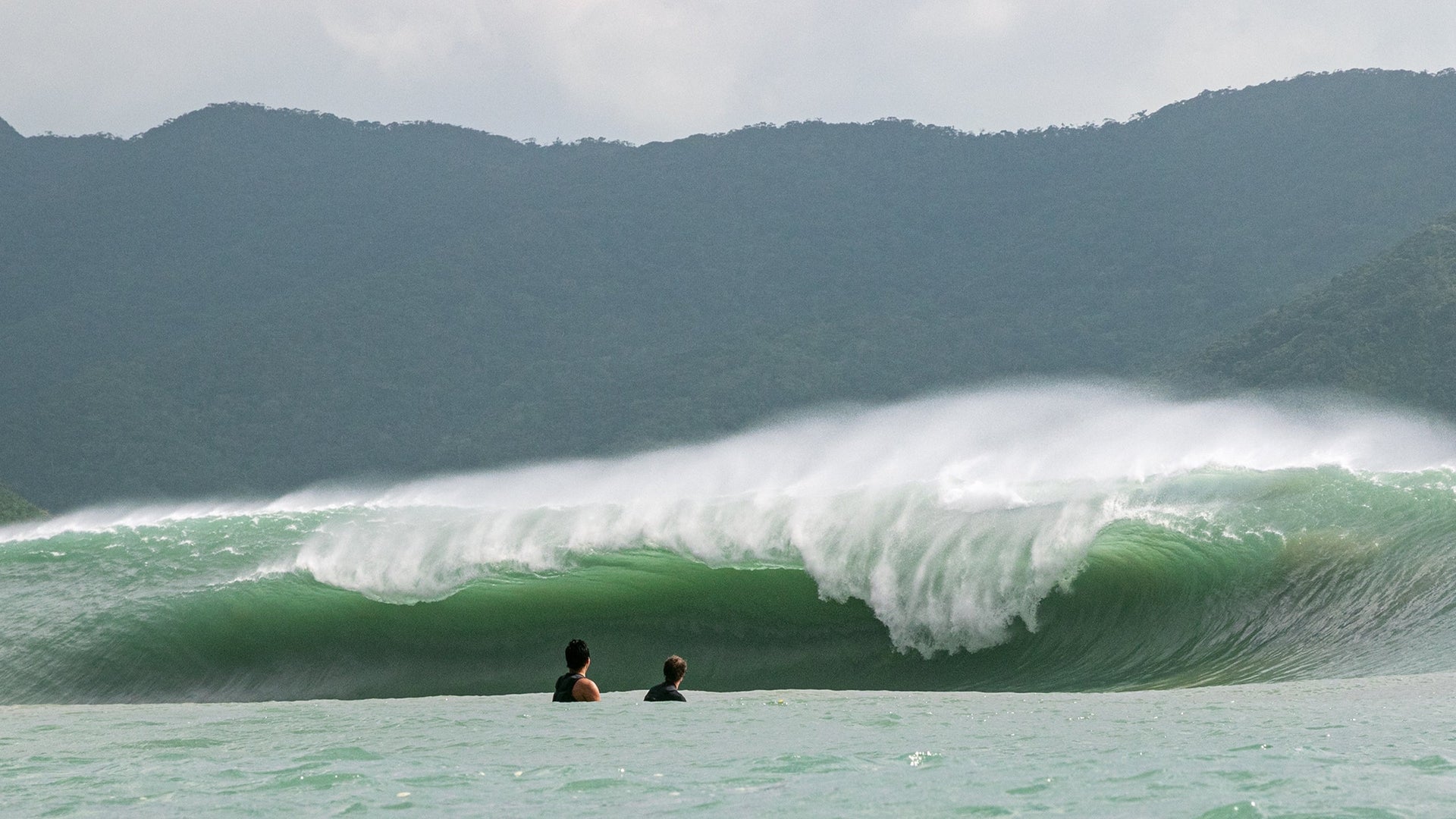 Keeping a safe distance, Yusei Ikariyama and Kohl Christensen gaze down the gullet of a hungry, typhoon-generated slab. Photo: Hisayuki Tsuchiya.