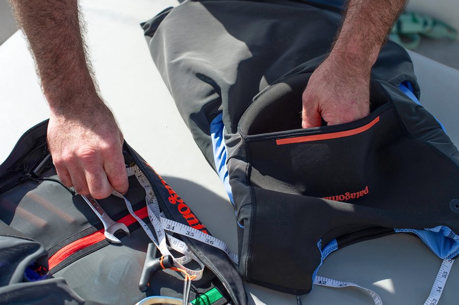 A hand pulling the handle of a PSI Vest.